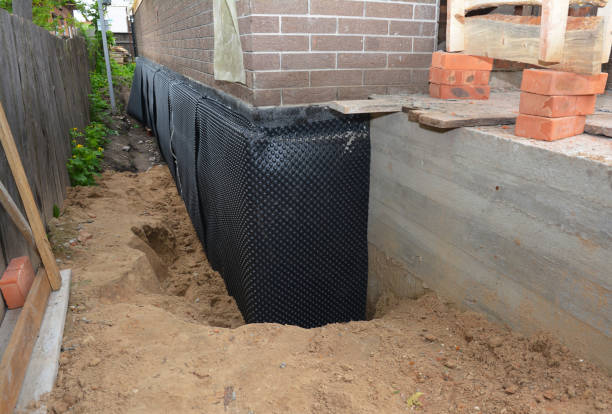 Happy homeowners after waterproofing job in Pike
